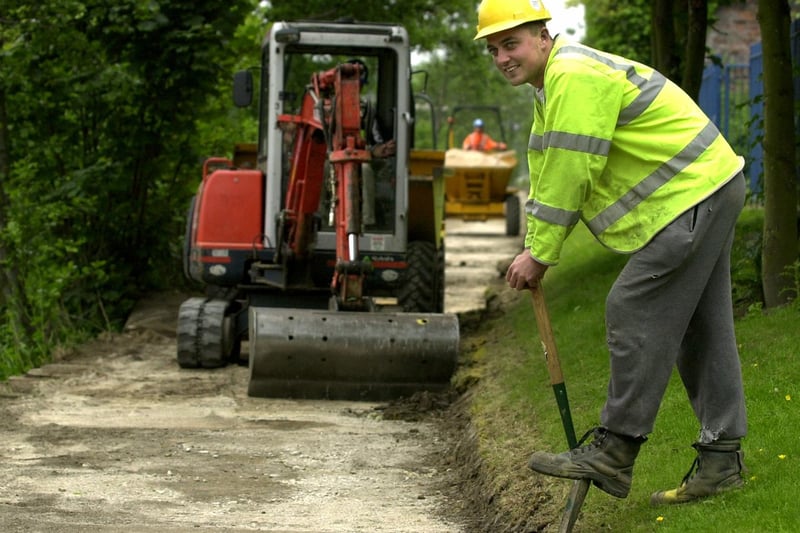 June 2002 and alliford Northern's Kieran Dillon works on the refurbishment of the Trans Pennine Trail on the banks of the River Aire near Hunslet.