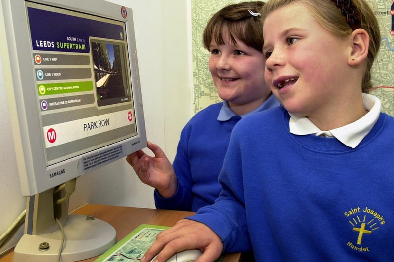 October 2002. and St Joseph's Primary School pupils Sascha Hanlon and Charlotte Walker try out the virtual reality Leeds Supertram.