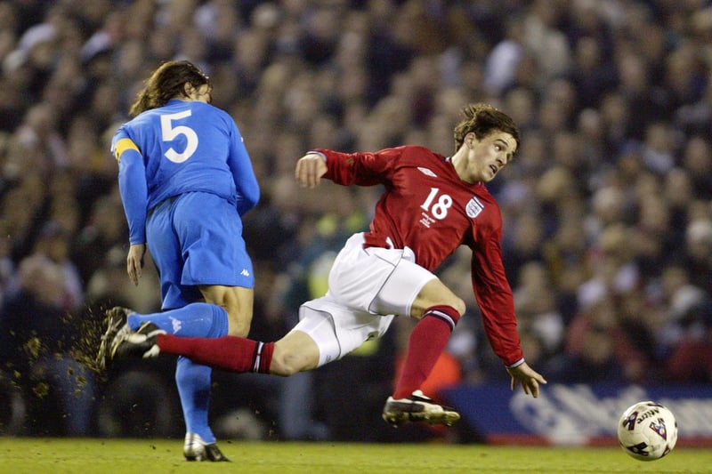 Three Lions and Bayern Munich midfielder Owen Hargreaves is taken out on the halfway line.