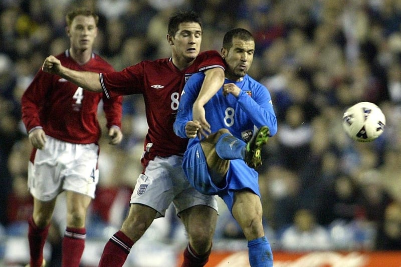 Chelsea's Frank Lampard challenges during a busy encounter under the lights.