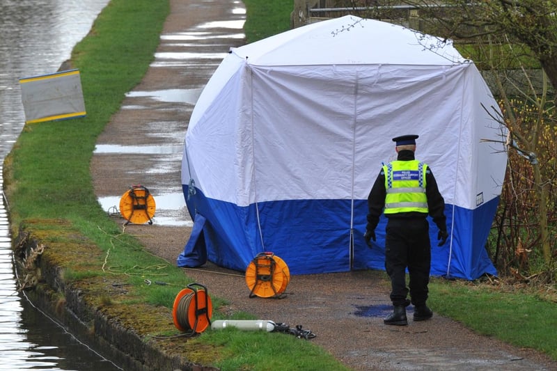 Police continue their investigations at Leeds and Liverpool Canal, near King Street, Leigh.