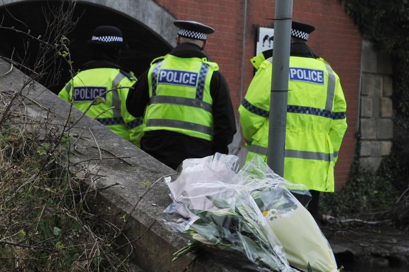 Flowers have been left near the scene with the police cordon still in place.