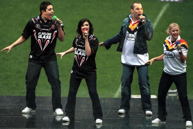 28 Apr 2001: Wiganer Kym Marsh wears a St Helens shirt as pop group Hear'say perform before the match between St Helens v Bradford Bulls in the Silk Cut Challenge Cup Final at Twickenham, London.