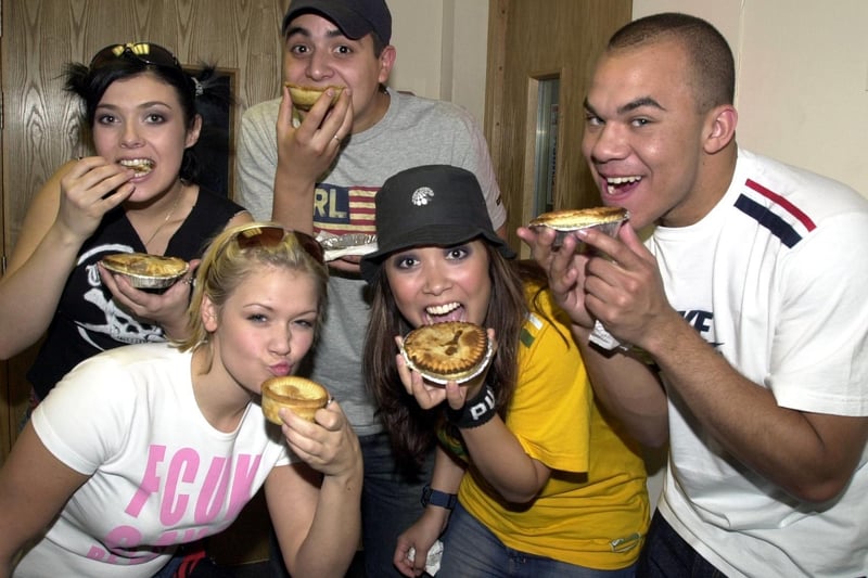 Kym Marsh with Hear'Say band mates, Suzanne, Noel, Myleene and Danny enjoying a pie during a visit to Wigan in May 2001.