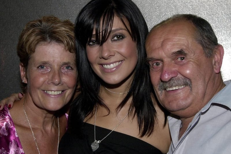 Kym with her mum Pauline and dad Dave, July 2003.