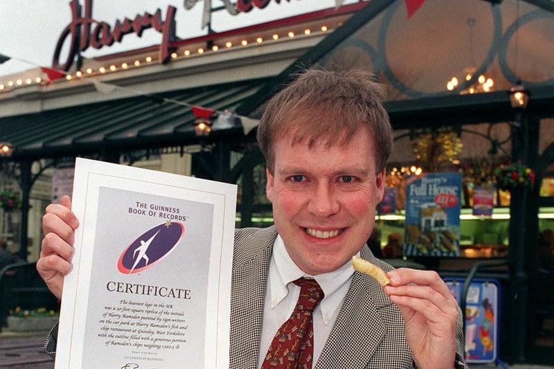 December 1998 and Harry Ramsden's marketing manager, Bob Acrey, proudly shows off a certificate from the Guinness Book of Records for the restaurant's heaviest logo in the UK.