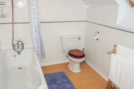 Luxury suite comprising of a tiled bath with a shower attachment, walk in shower cubicle, pedestal wash hand basin, low level WC, chrome heated towel rail, fully tiled walls, tiled flooring, frosted double glazed window, radiator.