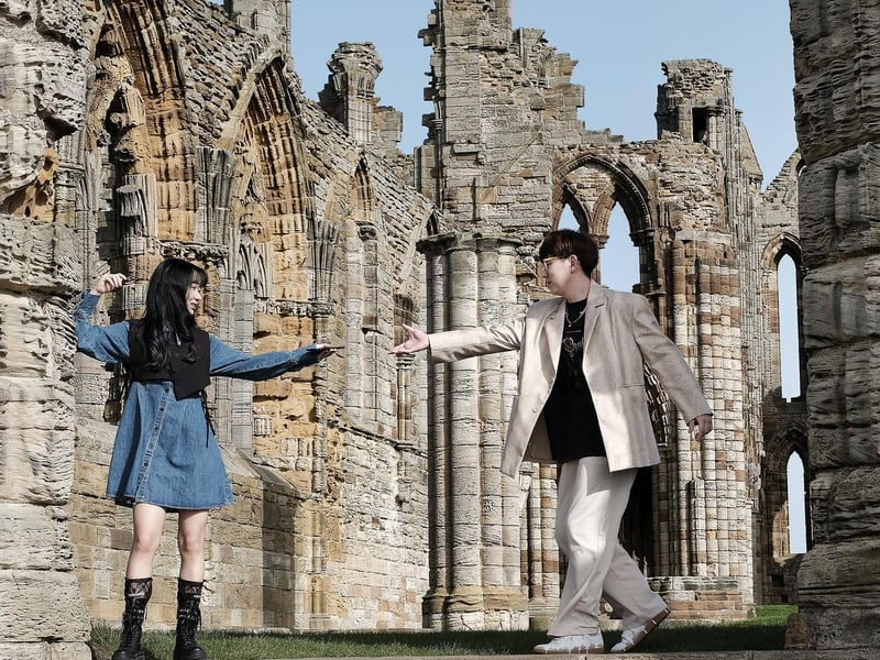 Visitors take photos in the historic surroundings.
