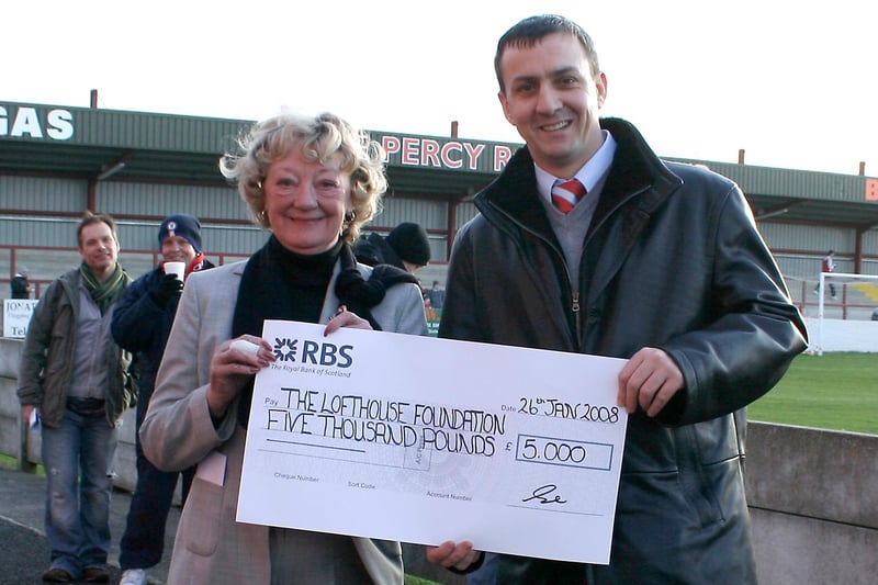 Fleetwood Town chairman Andy Pilley presents a cheque to Doreen Lofthouse OBE for the Lofthouse Foundation in 2005.
