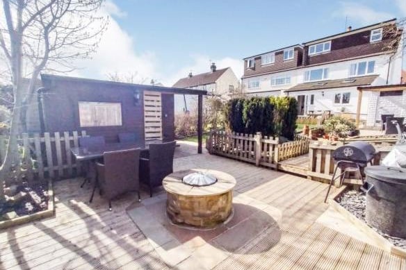The rear garden features a paved patio, a large pergola and terrace, a decked terrace to the rear is ideal for entertaining. The garden has a lawn, a gravelled path and established borders.