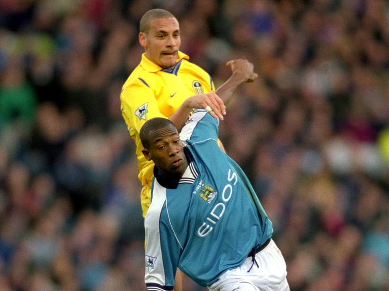 Manchester City striker Paulo Wanchope shields the ball from Rio Ferdinand.