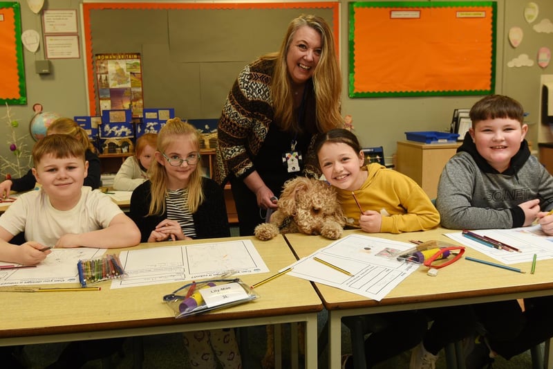 On the 9th of March pupils were welcomed back into the classroom, as some lockdown restrictions were lifted.  Pictured are Headteacher Jane Chambers with pupils and Pip the school dog and pupils happy to be back to school at Orrell Lamberhead Green Academy, Orrell,