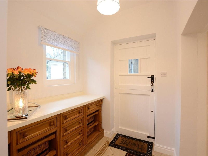 Enter through the original metal door dating back to 1667, into the light and airy inner hallway. Leading from the hall is access to an array of useful rooms, practically designed by the current owners to maximise on storage.These rooms include a boot room with ample cupboard space and access to private courtyard and a larder room with fitted shelves.