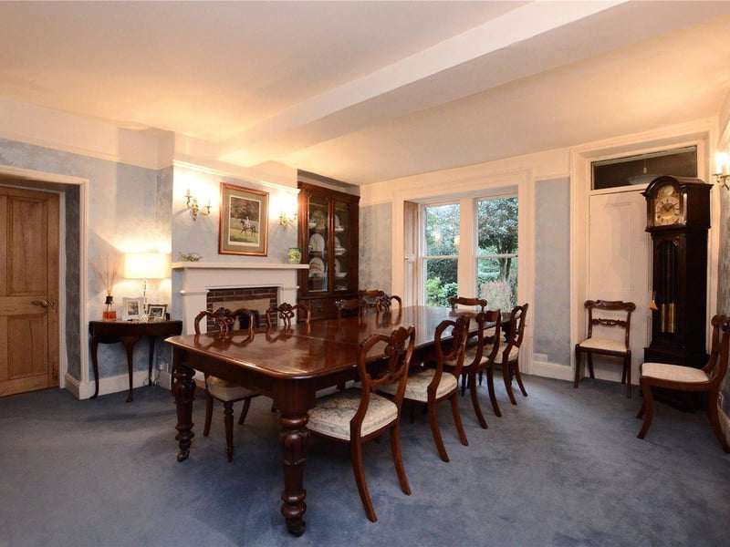 The formal dining room features the original front entrance door to the house, windows with original restored shutters and feature fireplace with brick surround. There is also a large reception room, which could be used as a playroom or further sitting room., as well as a library, which would originally have been an Anderson shelter during the war.