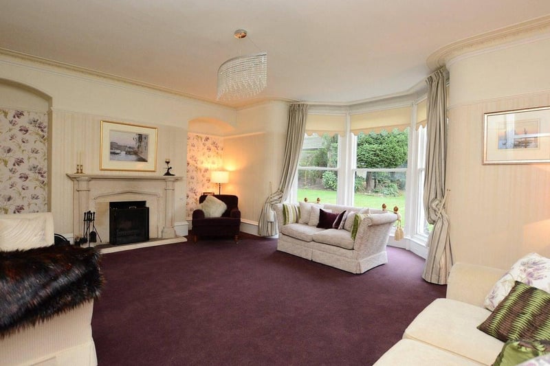Moving into the Victorian addition of the home is the formal lounge. The room features a large bay window with floor to ceiling glazing overlooking the rear gardens. It also has an open fireplace with a Portland stone surround.