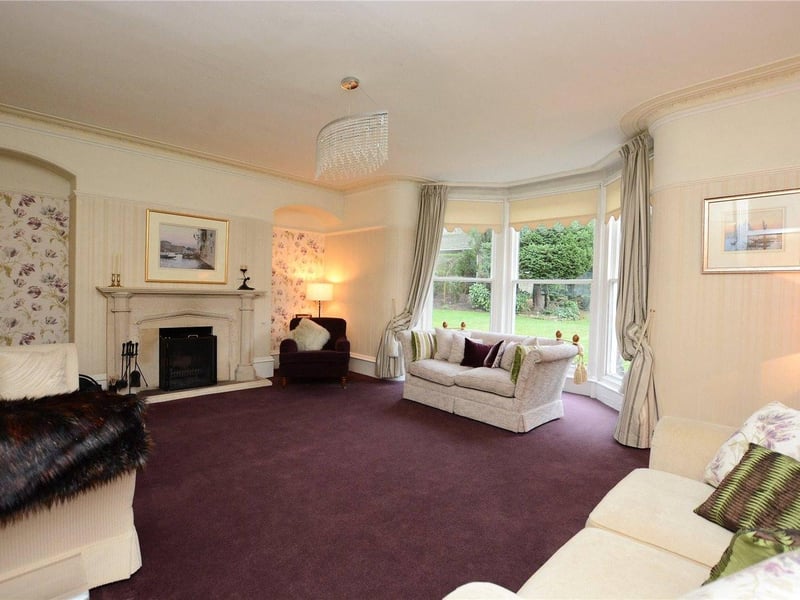 Moving into the Victorian addition of the home is the formal lounge. The room features a large bay window with floor to ceiling glazing overlooking the rear gardens. It also has an open fireplace with a Portland stone surround.