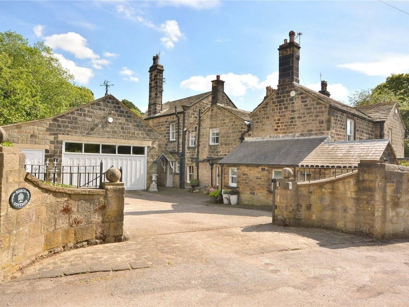 Moving outside, the property is fully enclosed and has an electronically controlled gated driveway, with ample parking and three garages. A pathway to the side of the garages leads along a walled walkway to an alarmed outbuilding, with stable stalls already in place.