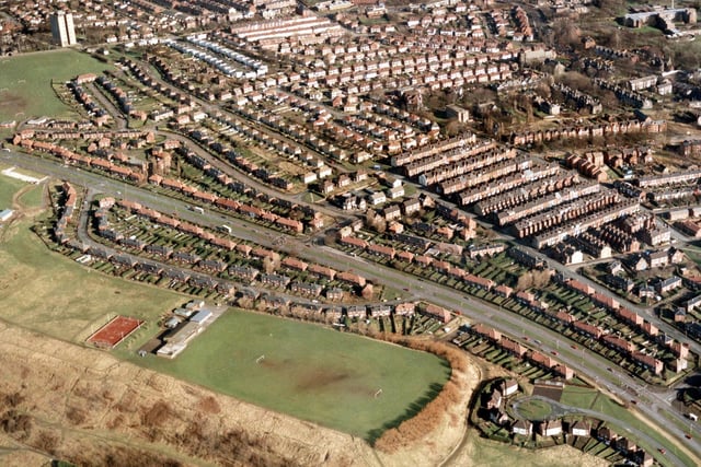 An aerial view showing Scott Hall Road running diagonally across the centre. On the left  are properties in Scott Hall Avenue laid out in 'boat' shape. Jutting out from the avenue into the green area is the Prince Philip Centre.