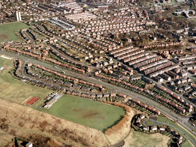 An aerial view showing Scott Hall Road in February 1988 running diagonally across the centre. On the left  are properties in Scott Hall Avenue laid out in 'boat' shape. Jutting out from the avenue into the green area is the Prince Philip Centre.