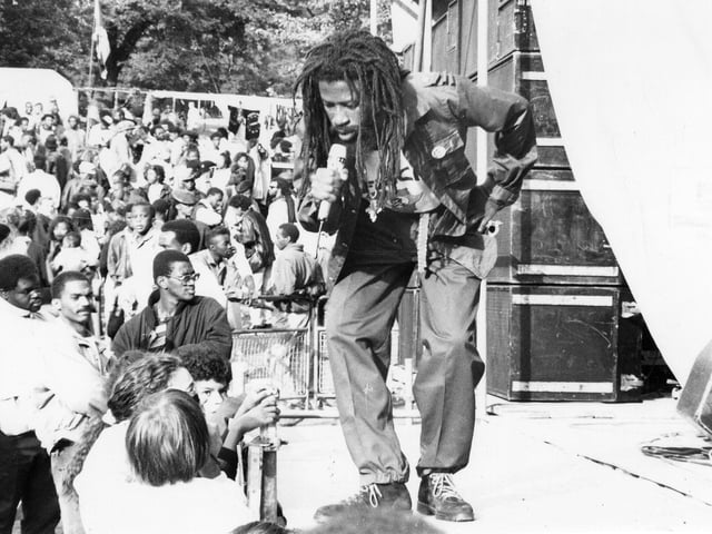This is Jamaican Dub poet Ras Fikre on stage at the Black Music Festival held in Potternewton Park on August Bank Holiday Sunday in 1989..