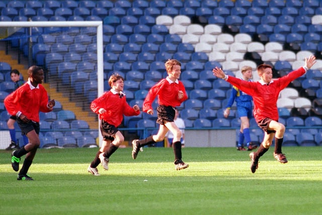 Follow the scorer. Scott Morley (right) takes the acclaim after scoring in their 3-2 win over Woodkirk in the Don Revie Cup Final at Elland Road.