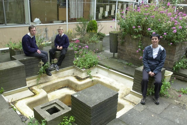 Cape Co-ordinator Karen Brown works with pupils to re-design and build a new area within the school. She is pictured with Lyndon Strickland (left) and Mark Farrar (right).