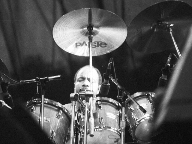 This is Chester Thompson on drums one of two additional musicians who helped bring the band's hits to life. The other was Daryl Stuermer.