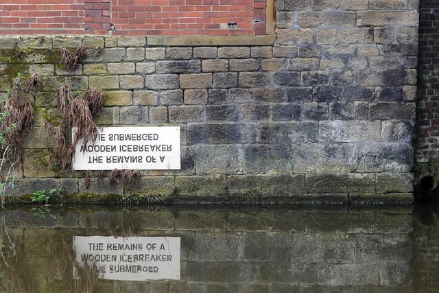 The sign on the Leeds Liverpool canalIt reads: 'The Remains of a Wooden Icebreaker Lie Submerged' and is found near the Leeds Industrial Museum, Armley Mills.