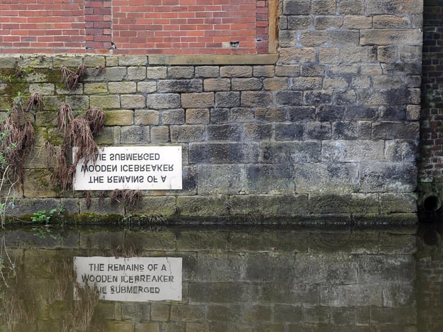The sign on the Leeds Liverpool canalIt reads: 'The Remains of a Wooden Icebreaker Lie Submerged' and is found near the Leeds Industrial Museum, Armley Mills.