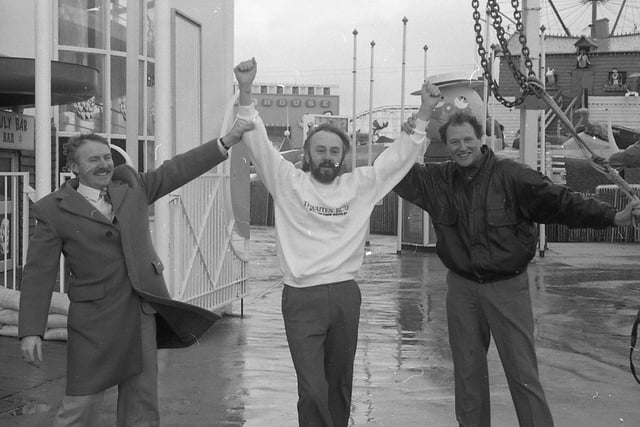 Escapologist John Roberto braved his winds at Blackpool to herald a top magic convention - hanging in a straitjacket 75ft above the ground on a burning rope. John - who escaped in the nick of time - was one of several artists who gave an impromptu free show on Blackpool Promenade. John is pictured above with Derek Lever, president of Blackpool Magicians Club, and convention organiser Tom Owen