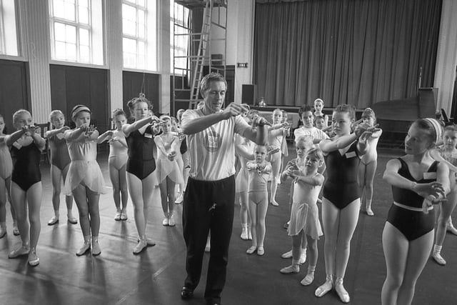 A visit by Royal Ballet Company to Queen Mary School in Lytham was enough to encourage the pupils to swap their uniform for tutus. There was a special treat for the youngsters when Oliver Simons, ballet master for the company, agreed to give them some lessons. He is pictured above putting some of the children through their paces