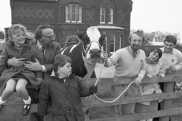 Farmer John Loftus introduces Dolly the cow to Geoff Gwilliam, head of Pear Tree School, David Hargreaves and Oliver Melling of Kirkham Rotary Club and pupils Rachel Iddleson, Paul Clarke and Carol Jones. Dolly the cow is helping Kirkham and District Round Table to raise 2,000