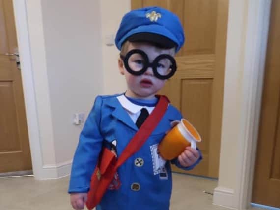 Louise Walker sent this photo of Postman Pat Harrison, aged two, celebrating reading at nursery all week.