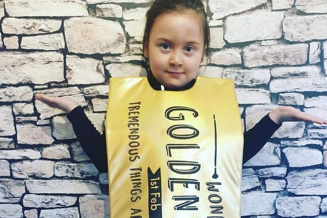 What a terrific costume and idea! Toni Legg sent us this photo of her daughter dressed as a Willy Wonka golden ticket.