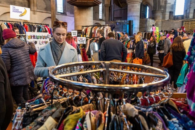 Shoppers browse the racks of vintage clothes