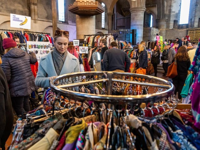 Shoppers browse the racks of vintage clothes