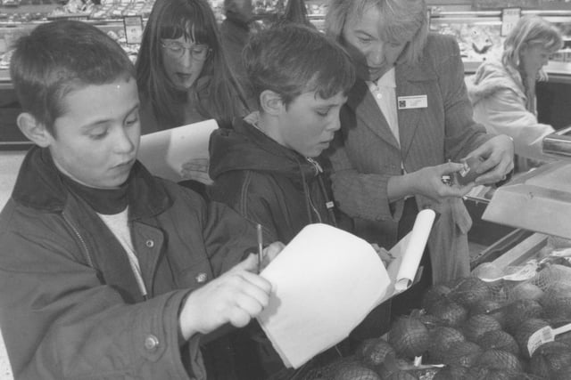 Overdale School pupils were on an educational visit to Morrisons back in February 1996. Pictured is Marie Oakden, personnel manager for Morrisons, explaining the range of countries that supply fresh produce to the supermarkets.