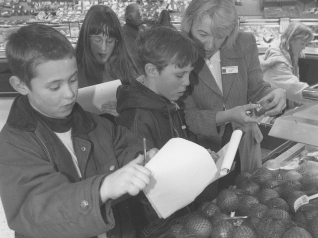 Overdale School pupils were on an educational visit to Morrisons back in February 1996. Pictured is Marie Oakden, personnel manager for Morrisons, explaining the range of countries that supply fresh produce to the supermarkets.