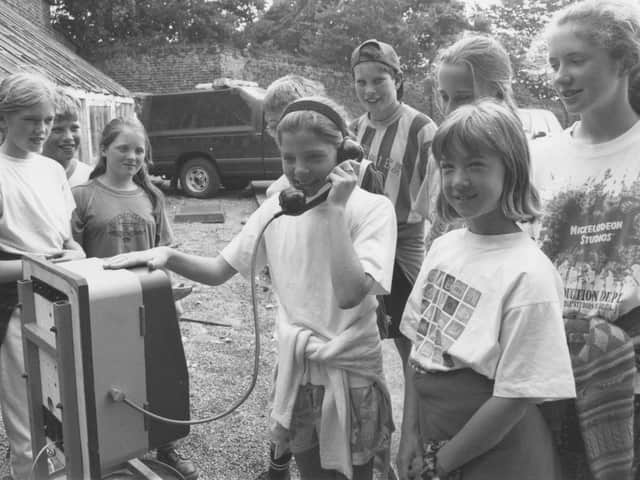 In June 1996, Louise Atkinson, of Hunmanby Primary School, made an emergency 999 call as part of an emergency services day for the school. Louise is watched by fellow classmates.