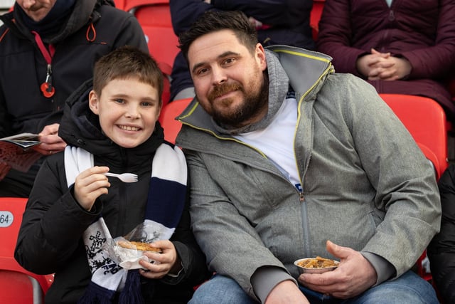These PNE fans tuck into a pre-match pie at the bet365 Stadium