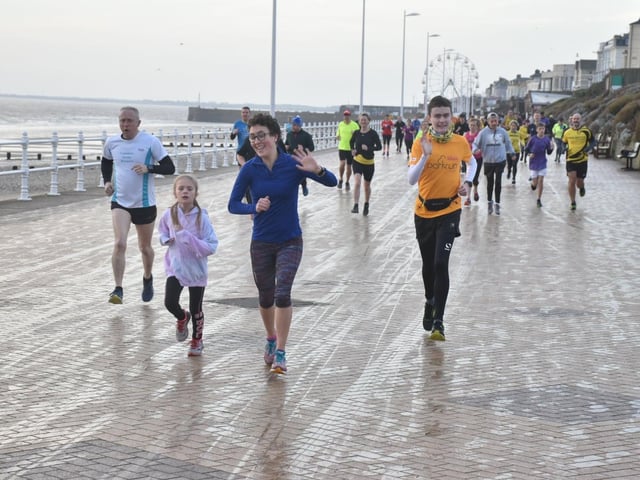 Ben Edwards, orange shirt, in action at the New Year's Day run