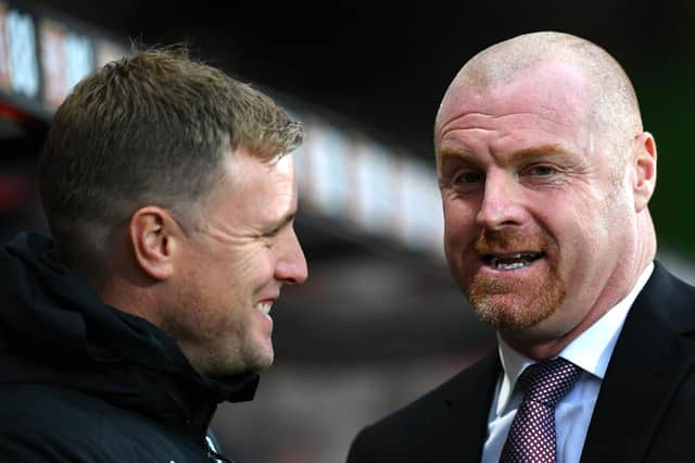 Eddie Howe, Manager of AFC Bournemouth talks to Sean Dyche, Manager of Burnley prior to the Premier League match between AFC Bournemouth and Burnley FC at Vitality Stadium on December 21, 2019 in Bournemouth, United Kingdom.