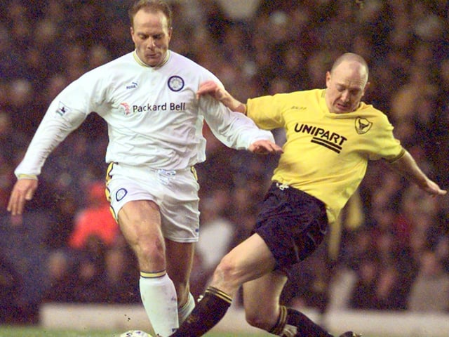 Robert Molenaar drives forward as Oxford United's Stuart Massey tries to tackle him.
