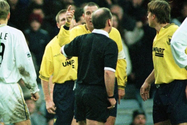 Referee Mike Reed sends of Oxford United midfielder Martin Gray.
