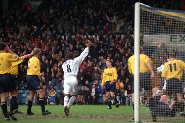 Oxford United goalkeeper Phil Whitehead and his teammates are left dejected after Lucas Radebe scored his first ever goal for Leeds United.