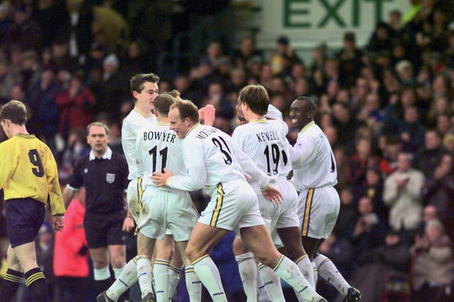 Lucas Radebe is mobbed by his teammates after scoring his first ever goal for Leeds United.