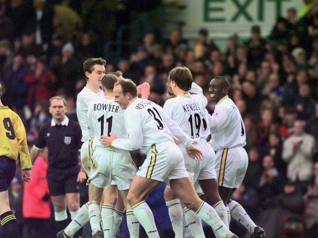 Lucas Radebe is mobbed by his teammates after scoring his first ever goal for Leeds United.
