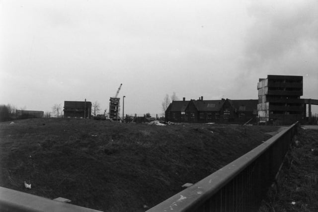 Leek Street Flats pictured during the process of demolition in 1983. In the foreground, the flats of Elm Tree Chase have already been demolished, leaving a view through to the former Jack Lane School, here occupied by the Leeds Athletic Institute. PIC: Ray Dickinson