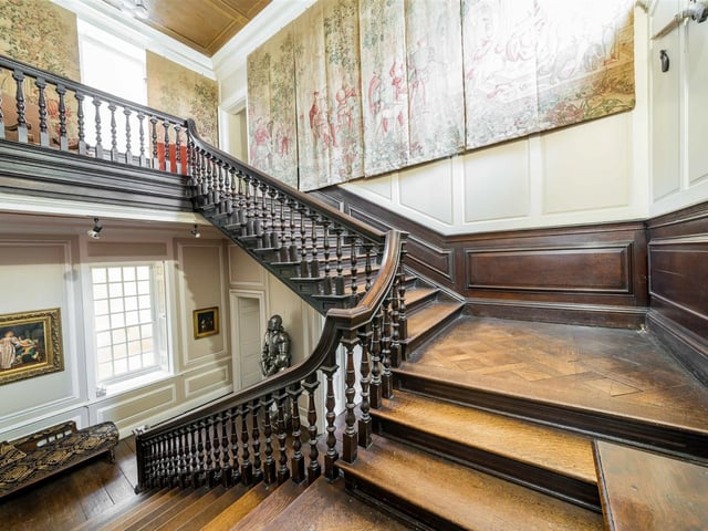This impressive oak staircase sweeps up from the great hall to the first floor, and a galleried landing.