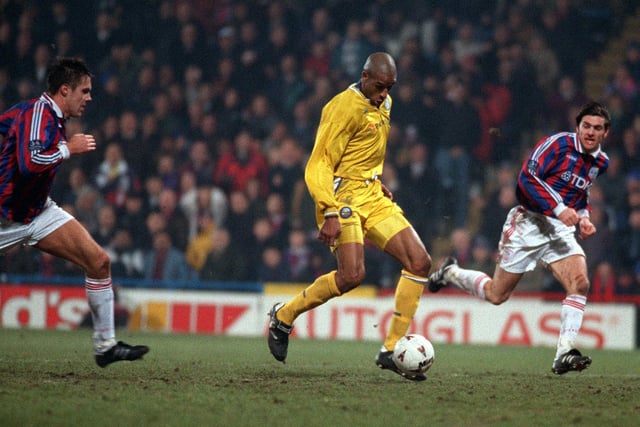 Brian Deane is clean through in the dying minutes of the game, but delivers a weak shot on goal.